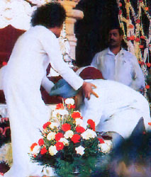 Prime Minister of India, Singh, with Sai Baba